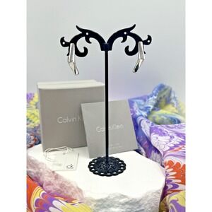 Calvin Klein Silver Tone Geometrical Twisted Square Huggie Earrings NWT..